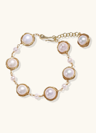 14K gold plated bracelet featuring wire-wrapped freshwater pearls in nest-like settings with adjustable chain closure