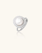 Sterling silver ring with 9mm freshwater pearl center surrounded by double halo of sparkling crystals