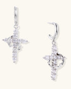 Ornate cross dangle earrings with zirconia stones and gold-plated brass construction on white background.