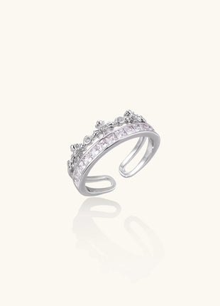 Adjustable gold-plated crown ring with zirconia crystals in ornate tiara design on white background.