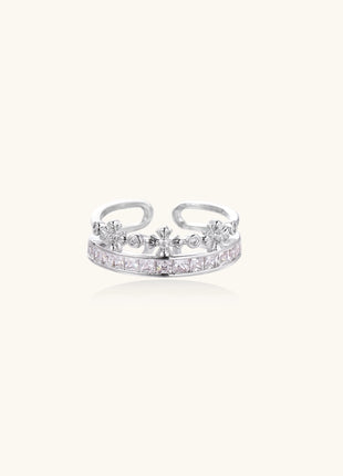 Adjustable gold-plated crown ring with zirconia crystals in ornate tiara design on white background.