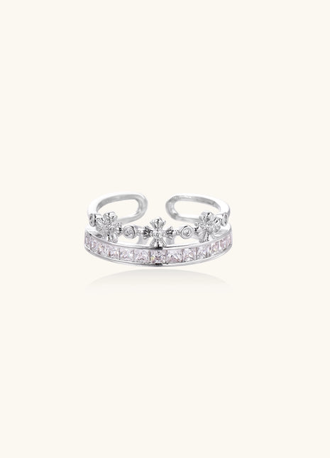 Adjustable gold-plated crown ring with zirconia crystals in ornate tiara design on white background.