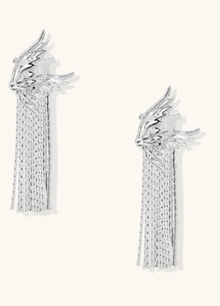 Gold-plated wing earrings with delicate chain fringe tassels creating movement and celestial appeal