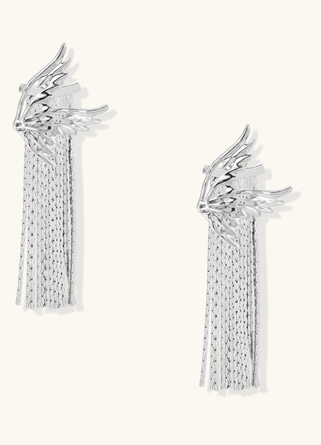 Gold-plated wing earrings with delicate chain fringe tassels creating movement and celestial appeal