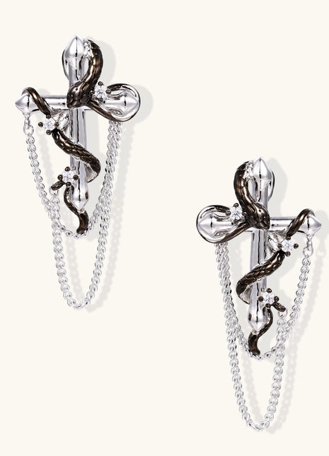 Gold-plated brass statement earrings featuring cross pendants with serpent details and hanging chains