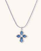 Gold-plated cross pendant with blue denim fabric insets and central zirconia stone on adjustable snake chain