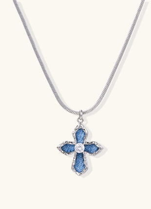 Gold-plated cross pendant with blue denim fabric insets and central zirconia stone on adjustable snake chain