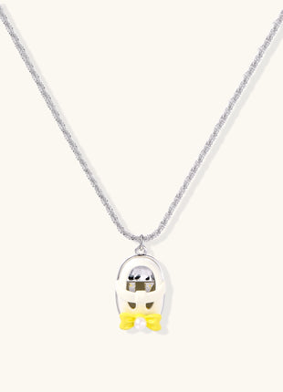 Minimalist gold plated brass necklace with cute capsule pendant featuring yellow bow detail on neutral background.
