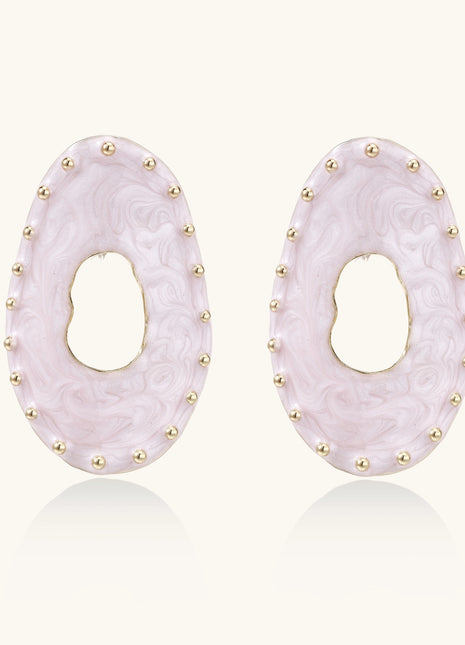 Oval lavender enamel earrings with gold studs around perimeter and cutout centers on white background