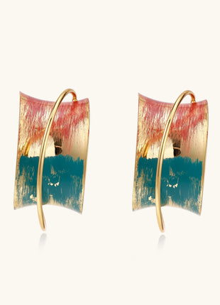 Gold-plated hoop earrings with colorful enamel brushstroke patterns in turquoise, coral, and gold tones