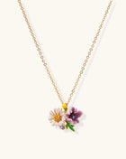 Delicate 18K gold plated necklace featuring colorful enamel flowers in pink and white with green leaves on chain
