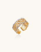 Bold geometric ring with lattice pattern in gold-plated brass featuring multiple tiers of sparkling zirconia stones