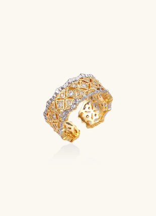 Bold geometric ring with lattice pattern in gold-plated brass featuring multiple tiers of sparkling zirconia stones