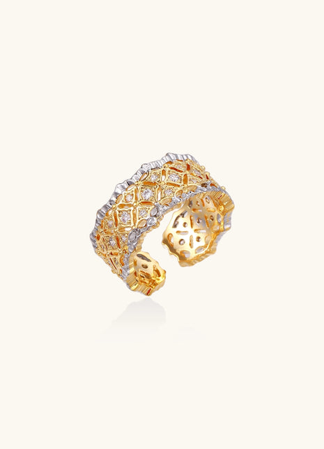 Bold geometric ring with lattice pattern in gold-plated brass featuring multiple tiers of sparkling zirconia stones