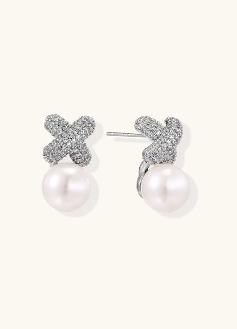 Elegant drop earrings with pavé crystal cross tops and round freshwater pearls on 14K gold plated brass setting.