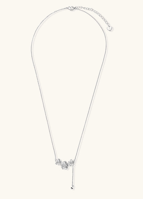 Delicate Y-style necklace with three textured flower pendants and adjustable chain in 14K gold plated brass finish.