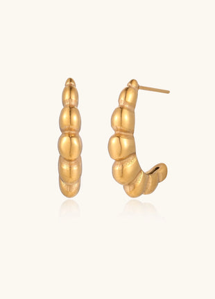 Gold-plated stainless steel hoop earrings with segmented bubble design and post closure on white background