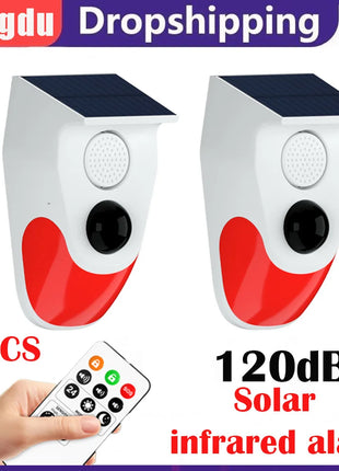 Dual outdoor motion detectors mounted on exterior wall