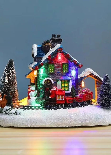 Ornamenti natalizi per la casa luminosa in resina Figurina per la casa delle nevi illuminata a LED Ornamento per la casa del treno di Natale