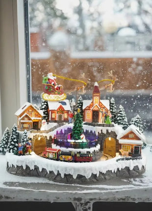 Fornitore di decorazioni natalizie Casa del villaggio musicale a LED Albero di Natale che gira il treno sportivo Statua di Natale