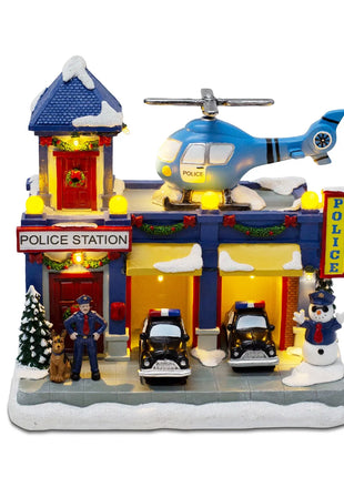 Stazione di polizia animata del villaggio di Natale, musicale illuminato con auto in movimento e elicottero rotante, edificio da collezione per le vacanze