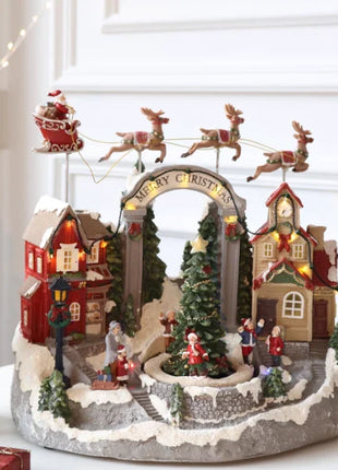 Fornitore di decorazioni natalizie Casa del villaggio musicale a LED Albero di Natale che gira il treno sportivo Statua di Natale