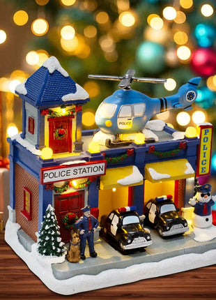 Stazione di polizia animata del villaggio di Natale, musicale illuminato con auto in movimento e elicottero rotante, edificio da collezione per le vacanze
